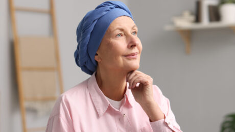 Portrait of senior woman with cancer at home