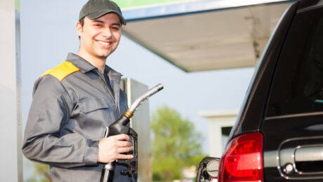 Smiling gas station worker